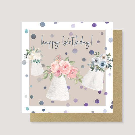 Floral party hats birthday card